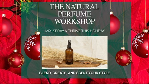 Image of essential oil bottle on a blue background. Behind that are red ornaments.