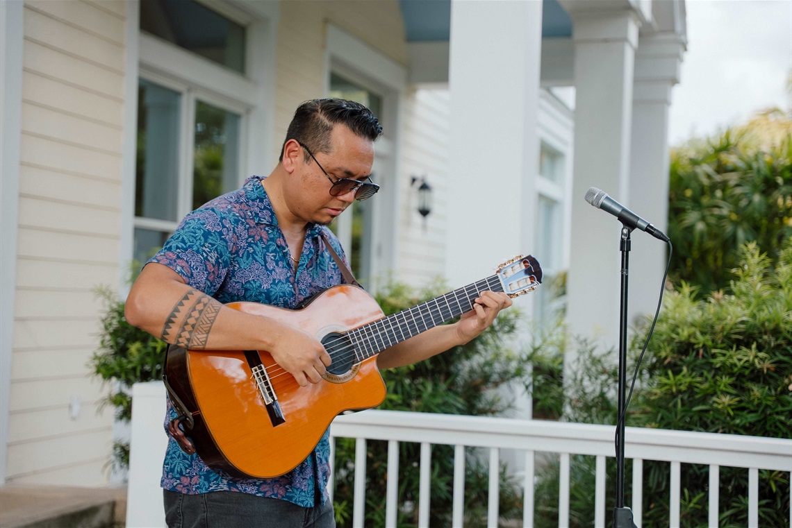 Don Soledad performing with his guitar.