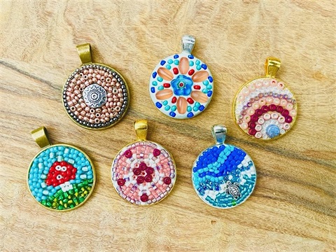 Handmade, colorful jewelry pendants.