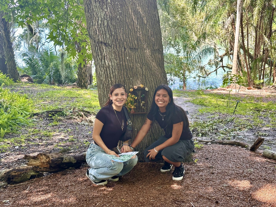 Two people who found a fairy door.