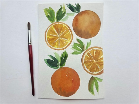 Watercolor painting of oranges and orange slices, next to a paintbrush.